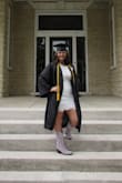 This dress was perfect for my graduation. I have a back tattoo and loved the open back. It was a perfect white and fit my body just lovely. I wore a sticky bra just for a little bit of support. Made very well and loved how they offer a student discount. - Kiley B.