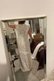 So I ordered 5 dresses from Lulus and this was my second favorite. I thought it was flattering and fit well, I mainly didn't like that the back was full coverage. Also, the ruffles were a bit much. I love the side slit though, it really helped to make it a little sexier. - Amy A.