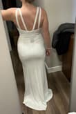 Bought this dress for my wedding. I love this dress! It's so simple and so gorgeous. The neckline is so pretty and it is stabilized with an insert along the seam so there is a lot of support to hold you in and keep the shape of the dress in the chest area. I was looking for a v-neck gown for so long and finally found this one. It's an incredible dress. - Ashley K.