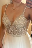 I love the dress! It's absolutely Gorgeous, but after putting it on I felt more prom queen the Bride! So sadly I'll be sending it back. Size 2 fit perfectly and wouldn't need any alterations except to hem bottom. - Lauren C.