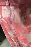 The top's tie is lower than I expected to be across my back, so that didn't fit me well (more of a personal fit problem than an issue with the outfit). The skirt fits well. However, the zipper stitching in the back of the skirt is not concealed at all. I understand there's a sheer layer on top, but for the price, this should absolutely be hidden; it looks cheap and you notice it from across the room. Also, there's black dye or something on it? I plan on returning this. - Carlyn V.