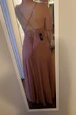 The bottom and back of this dress were SO flattering so I was super disappointed about how the top part fit. I was falling out of the top and I only have B's. To wear this dress I think you'd have to use lots of double sided tape and then also retrofit the back straps to stay up instead of sliding down? Maybe it was just too big, either way it was a no for me - Dorothy-Faye S.