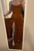 Reminded me of a Thanksgiving tablecloth. Such a flattering fit though, if you want a slit it's super hidden so def doesn't sit like the pictures of the model. - Dorothy-Faye S.