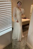 I like this dress. It is very relaxed and romantic, it has a good fit for the body, and the cross-body lace makes it easy to adjust. 

It is kind of heavy and long, but it is perfect for a small wedding. - Danielle F.