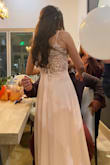 My daughter wore it for her 15th birthday. She looked perfect wrapped in that beautiful dress made of fine and soft fabrics, the buttoned part on the back is very romantic.
She was delighted with the flow of the dress and the color were perfect. - Brenda R.