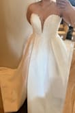 While I didn't keep this dress, I did love it! The material is great, the dress is heavy!!! 6ish lbs! The slit is very high and adds a lot of sex appeal to the dress if that's what you're looking for! Personally, I loved it! Dress is LONG, so if you're under 5'6 it'll need to be hemmed A LOT!
I'm usually a size 2-4 in princess/ball gowns, the 6 fit perfectly. Definitely size up 1-2 sizes! I imagine the 10 would fit like a 6.
However, after trying on other dresses this just was not my dress! I found many others I loved more! - Lauren C.