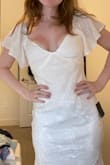 I was looking for a white, true "midi" dress for my upcoming college graduation and I think this dress has taken the cake! I went with my suggested size, small, and it fits perfectly, however, I will have to explore a bit on the no bra situation (I am a 32D, and while the dress has breast cut outs mine seem to disagree on this placement). I will say it does run a bit long as a shorter girl but honestly with heels I think it will look great. Also love that it is not super tight in the tummy area and if you have a bit of a belly you would still have room in a small! - Katelyn H.