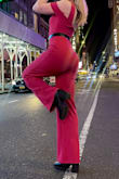 This fit exactly as I hoped it would! The color is amazing! A bit of a darker/rose pink than what's in the website pic, but I loved it even more. Super comfy! The fabric feels good and is fairly stretchy. I walked around in it all day, and could do all sorts of fun stuff and poses for pics:) For someone who has small boobs lol, I the side with no strap stayed up well (I used a sticky bra with it, too, which I think helped hold it up there haha). The pants are the perfect length for me, especially with heels! I added a belt to it because I wanted a good accent, but it looks good without one, too. Overall, SO good. Got so so many compliments and felt amazing. - Kelly K.