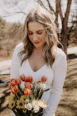 Let me start off by saying this was not my intended wedding dress. I had already purchased a gorgeous dress to wear on my wedding day in September 2023. However, my father-in-law became quite ill and we moved up our ceremony date so he could walk me down the aisle. 

I ordered this dress...very last minute. I took a chance and it was incredible. I have received so many compliments on this gown. It fit like a glove and was incredibly comfortable. The material is thick and great quality. I would 100% recommend this gown to anyone, it made my day so special. - Emily S.