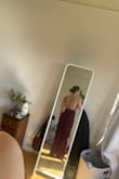 I tried both the large and medium. Both fit me, just in different ways. The medium hugged my body more and the large is a bit more loose in an elegant way. I ended up going with the large so I can use it for more formal events (ie a wedding). If I wanted to wear it more casually, I might've gone with the medium. As a tall person, it can be so hard to find something that is long enough and I love that the pant legs go all of the way to the floor. - Jennifer M.