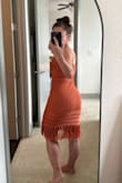 My bottom is 2 sizes larger than my top so it is very difficult to find dresses that fit me properly. I ended up exchanging the S for an XS which fit wonderfully! The crochet is forgiving enough that the XS didn't look stretched to maximum capacity across my booty and and the dress has enough elasticity to keep its form on top against my tiny boobs. I will still probably have the straps taken in a bit (straps are pinned in pic), but I'm very small on top. The top does not have a lining but (on me) you cannot see through the crochet. It IS very form fitting so if you don't want hot weather pillow nips showing through you'll need to wear petals. - Robyn L.