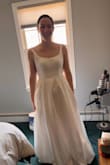 This is a beautiful dress and I loved how I felt in it trying it on! The straps that go around my shoulders/arms were a bit too tight, though, and made that annoying skin/fat part by the armpits stick out - you girls know what I'm talking about here. I'm not busty at all though I do have more of an athletic build, so maybe it had to do with my shoulders? Regardless, I still really liked it. I have some other dresses I want to try on before making a final decision, but if I do go with this dress, I'm going to get the next size up and then just get it tailored to fit me exactly. - Madison M.