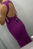 Great dress. 

Pros:
The fabric is a little heavy so it feels expensive. 
I like the lining.

Cons:
The zipper feels like it could break and it's also tight, if I gained half a pound it wouldn't close. If I would reorder this dress I would go for a Medium.

The color isn't a dark fuchsia or magenta like shown in the picture, it's more like a purple, exactly Barney's color. I wanted a pink dress, not a purple one so that's a bummer. - Gabriela C.