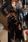 Does run a little on the small side I first ordered a large and it did not fit my body well so I ordered an extra large and fits like a glove.  I do have a cami underneath it cuz the cleavage area does cut pretty low.  I do like how the sleeves flutter to help cover my chunkier arms I like the higher waist.   cute,  it conceals the tummy area.  As you get older your body changes.  So ladies I am wearing a gridle. 
Fabric is  flowy & breathable should be okay for summer time weddings and get togethers.  I'm going to wear it at my niece's college graduation but by wearing a little denim jacket as seen in the pictures to help accentuate the waist really cute.  I'm 5'9 so I'm pretty tall and in the pictures I'm also wearing a 1 inch heel the length of the dress is perfect does not hit the ground but if you run a little on the shorter side you may need to hem it.  Overall great dress great quality for the money.  Also Lulu's is wonderful to work with when you need to make a return/exchange super fast no problems. - Kristina A.