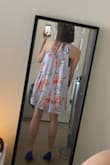 I was worried it would run large but I find it fits true to size! My chest is broad (in between size S and M) but hips are narrow (XS) according to the size chart and I found S to fit well. Material is a little cheap feeling, but I won't complain for the price. I plan to wear it to a summer wedding, probably with nude heels. Very breezy and pretty! - Una M.