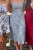 The dress is so flattering yet still modest and was perfect for an outdoor spring wedding. I love that the straps are adjustable, and the stretchy back makes it a perfect fit. The fabric was nice material, and the threads of silver running through it make it shimmer subtly. Such a great value! - Lily H.