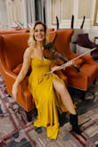 I purchased this dress to wear for a concert I played and read it ran a little big so ordered xs instead of my usual s. It fitted perfectly! Material is great quality and got so many compliments. Split is not too high and the top has adjustable straps which is great. - Rachel G.