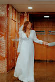 My husband and I had a simple courthouse wedding this winter and this dress did the job! I had ordered a dress from a different website and last minute changed my mind when I saw this dress! It shipped extremely
quickly and got to me the day before the wedding. It was perfect! It fits great! I'm 6'0 tall and it still swept the floor in heels. I loved it! So did everyone else too lol If you are chestier I highly recommend wearing with "boob tape". 

The only negative is it says white, but it is definitely closer to a cream. - Mackenzie F.