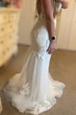 This dress is pretty much my dream dress for a reasonable price! We are eloping and I couldn't imagine myself spending 1000+ on a dress, I never thought I would get something this beautiful for this price! It is super lightweight for how much dress there is! I'm barefoot in the photos and I'm 5'5, I had a hard time getting the entire dress out and flat for pictures by myself. I find it TTS, I'm generally a pretty solid size 6 dress, size 4 pants in AE, 34d bra, and 142 lbs the day the pics were taken. I have a severe case of scoliosis and surprisingly the low back it does not accentuate my curve! - Jennifer R.