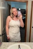 I got this dress for my bachelorette party & it's going to be perfect. It is a little outside my comfort zone because I don't have a "toned" back & my couple of rolls do show but the dress is so cute that I'm going wear it anyways. You definitely need someone else to tie it! I'm 5'10" & the dress covers my butt which has always been a struggle. I love that you can adjust the tightness of the top with the adjustable crisscross straps. It's NOT see through which has been a huge struggle for me finding dresses for my wedding events. Overall love the dress & I'm excited to wear it in June! - Lauren G.