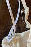 CONS: #1): At my reception one of the straps broke; Thankfully I had safety pins with me, and my sister helped me pin it.  #2): the stitching near the 'hook' at the top of the zipper was coming out when I received it but I didn't have time to return for another one (re: wedding date!).  I hand-sewed it to reinforce it.   Additionally, the zipper was a bit hard to zip.
PROS:  I loooved everything about this dress, and out of 4 wedding dresses I chose this one! I did have a seamstress sew in small cups -I'm "small" up top.  I tried a medium and a small, and the small fit perfectly -I probably could have gone without the sewed-in cups, but I wanted a "little" cleavage lol.  I felt very comfortable in it and had lots of great comments on it! I wanted to add a few more photos but the review process wouldn't let me. - Ba H.