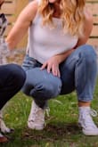 I really liked this top and wore it for some more casual engagement photos. It fits loose and seems shorter on me than it is on the model. I wore a nude bra under for photos and didn't have any issues. I'm sure if you really looked at it you could tell though. - Cady W.