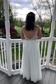 Absolutely in love with this dress for my micro wedding! I got so many compliments. It fits like a dream. I only needed to get it hemmed. I did have an extra pin added to the back to make it fit more, it does sag a bit. It rained on my wedding day and this dress held up well. No stains or anything. - Harley S.