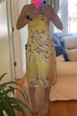 This dress is not pastel yellow or silky. It looks horrible on. - Colleen C.