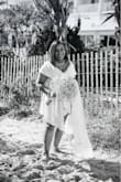 I love this dress!! I originally ordered the dress for my court house wedding but we decided to have beach wedding because we wanted to invite more of our family and friends than the courthouse would allow. I originally ordered a large because I wear a 12-14 in a dress but exchanged for the XL. It fit perfectly and I made no alterations. I added a chapel length veil for the beach. - Michele S.