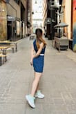 Very flattering cute little dress! Fitting is perfect, although some people may think it's a little too short. I preferred not to size up because the waist fits perfectly. - Ran B.
