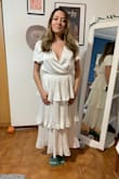 Bought this for my rehearsal dinner. It came incredibly large and long! I did order a M, but because I have a large waist. The waist ended up being stretchy thankfully. But, I had to get it heavily altered for the height and sleeves and by that time it looked more cocktail-y than I wanted. The color and fabric is pretty but I needed a slip because it was see-through. - Renatta M.