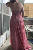 I ordered this dress with a few others to find a bridesmaid dress for a friend's wedding. This dress fits so nicely! The ability to lace up the back means that it has a good amount of leeway when it comes to the fit. There wasn't any weird gapping in the chest or any other areas. I also appreciated the placement of the skirt slit, it hits at a good spot and doesn't start too high up. I ordered it in both the pink and the yellow, but the yellow didn't match my skin tone as well as the pink. - Kailey M.