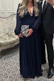 Bought this dress for a black tie wedding, I should have got it hemmed as it was quite long and was touching the floor even with heels. I got it in a size medium, It was slightly tight trying to zip up at the back but I think the large size would have been too big for my bust area so it worked out well. I had to use lots of boob tape and double-sided tape. I loved this dress, highly recommend it! - Leah B.