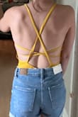 This is so cute! And the back detailing is so fun! I own a lot of bodysuits from Lulus and the xs for me is always a win! This fits me really well. You can see in the back there's a tiny bit of bunching/folding on the sides where the straps meet, but it didn't impact the fit at all. Can't wait to wear this all summer! - Jenn S.