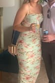 Ordered this dress after reading reviews and seeing the reviews with photos of it on people. This dress made me feel so confident! It is fitted but the stretchy material and ruching hides insecurities very well. I did wear shapewear underneath for extra confidence in overall shape, but the dress does a wonderful job even without it! Highly recommend. Didn't even need to steam it after it was packed in a suitcase for a few days. - Dakota B.