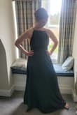 This was such a gorgeous dress and worked perfectly for a Scottish wedding at a castle. The fabric was soft and silky, but not shiny. Had a bit of texture which took some time to figure out ironing, but was ultimately very flattering. The bottom of the dress was terrifically swishy and laid in flattering folds from waist to foot. The top had enough structure to not need a bra, but was also flexible and comfortable to move in. The straps were adjustable which allows you to tighten and loosen as needed. Overall, a stunning dress and would definitely recommend! - Jordan C.