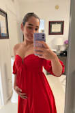 This is a beautiful dress. It is very casual and best paired with flats since it runs a little short. 
I'm usually a size small on tops but I got this dress in M, especially because I'm pregnant and my boobs have grown. 
I am used to small boobs so I was surprised at how my boobs stick out with it. Would not recommend for super busty women. 
Great option for pregnancy. - Alejandra S.