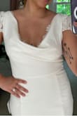 I have tried on a few white dresses from different brands, and they do not fit as well as this one. I was nicely surprised with a good quality fabric, the dress is lined, the shape is beautiful and the fit is very flattering. Absolutely love it, and 100% recommend! - Paloma G.