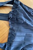 This dress is stunning but the quality is TERRIBLE! It had a rip at the seam under the bust on the front of the dress, and the ruffled detail hem was literally falling off - Shelby B.