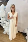 I wore this jumpsuit to my bridal shower and it was a big hit. Super comfy, the underlining is a satin material. The top straps wouldn't stay up on me, so I used double sided dress tape and it worked perfect. - Chelsey T.