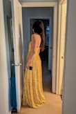 This is another beautiful dress from Lulus. The yellow is not super bright, it's a little muted and looks beautiful. The dress in the photo is size S and is a little small because the person wearing it is in between size S and M in Lulus dresses and the fabric of this dress has no give. The style and color are very flattering and the fabric is very summer. - Lidia R.