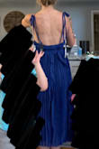 I purchased this dress at the request of the bride. I'm a bridesmaid in a wedding this summer. The back of the dress was great. The waist was a bit tight and the length is horrible for someone who is 5'3". I wanted to love it but I don't and it's ok because the bride is happy. - Danielle M.