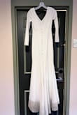 This dress fit great! The weight of the fabric made it lay so beautifully. We partied hard at the reception and I got a lot of rose wine and dirt from photos on it. But I only lost one button. Definitely recommend this dress again! - Stephanie S.