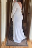 I ordered a couple dresses and ended up picking this one for my elopement in October. The fabric is nice and thick, great quality. Sleeves are a little long on me so I will be getting them hemmed a bit as well as the bottom but size wise, this is a perfect and I'd say true to size! - Leah H.