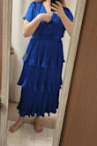The dress is made of pretty good material, but if you're tall, probably not for you. I have to have it for a bridesmaid dress or I wouldn't have kept it, I had to size up not because I needed a better dress but because the waistline was hitting right under my bust and flaring out from there which was very unflattering and made me look like I don't have a waist.
With it sized up it's better but waistline still hitting a little too high, and it's too big and loose in the bust so I have to alter it. 
If you are short it may be too long, but if you're medium height with a short torso then this may be the dress for you. 
It's just not designed terribly well for people with longer torsos.
First photo is size L, before getting a size up, 2nd photo is size XL which is too big in the bust. - Caitlin W.