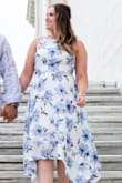 [EDITED] I wore this dress for my engagement photos and it was beautiful, however, we had difficulties getting the zipper up over the slit across the waist. Unfortunately, when wearing it again for my bridal shower, the zipper BROKE as we were trying to zip it up past that same slit in the waist. Even without the dress on, the zipper will snag a bit when getting over that part of the dress. It is a design flaw that they will hopefully fix!

[PRIOR REVIEW] I just tried this on last night in my usual size which is a Medium, and it absolutely would not zip up past my hips! It was wildly too small, but still absolutely gorgeous. I just ordered a large to exchange and hopefully, this size will fit because I love the dress! I'll be wearing it for my engagement photos. - Kaylie A.