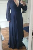 Very elegant and slimming definitely long I needed it hemed atleast an inch and a half with flats very nice quality and I'm looking forward to wearing it - Kata C.