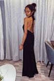Everything about this dress screams classic!  Think Faye Dunaway on an episode of Columbo in the 70s.  She wore a red dress, but it's the same style.  High tie neck with a stunning low back - we are currently on a cruise and I got lots of compliments all Friday evening (wore it to the Captain's Cocktail Reception).  Fits true to size. Not too snug; not too loose.  The best Lulus purchase I have ever made.  I want them in all colors. - Sheila N.