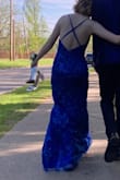 a very lovely dress. very vibrant color. fits well
only "bad" thing is that it's a little bit uncomfy to sit in. When sitting, it was a little tight around my thighs. some of the threads of the slit pulled from sitting down - Evangelina M.