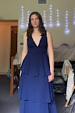 I love the dress, but of all of the dresses that I ordered this fit the smallest. It is a struggle to get it zipped up over the "waistband", and while I know that sometimes happens I'm scared I'll rip it every time I wear it. I'm usually in between a small and a medium, leaning towards a medium, and I honestly thought about exchanging it for a large but I didn't. It is super cute and I will be keeping it, just figured I would mention that it runs a little small :) - Ana L.